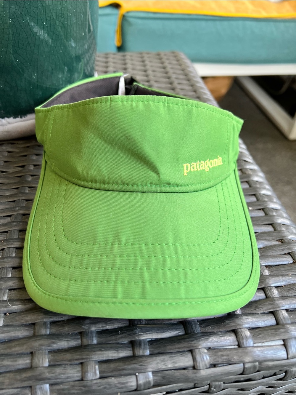 Patagonia Velocity Visor lightweight with nylon type fabric in green with logo.